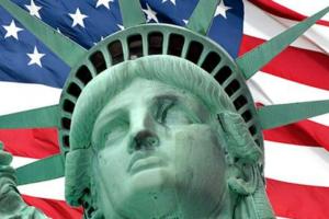 The statue of liberty and american flag.